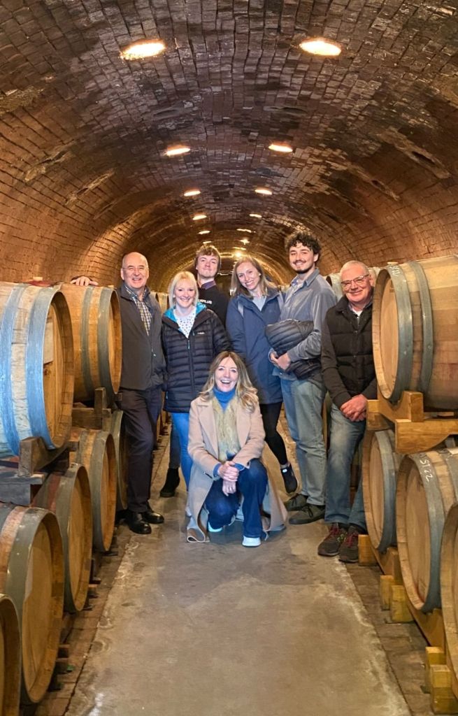 Dylan and staff at the Bidoli Winery, Italy