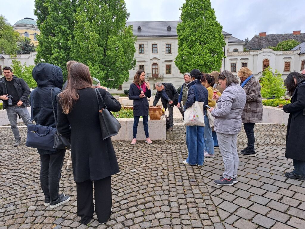 Group of people tasting outside the university of Eger.