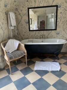A bathroom with a roll top bath at The Old Bridge Hotel