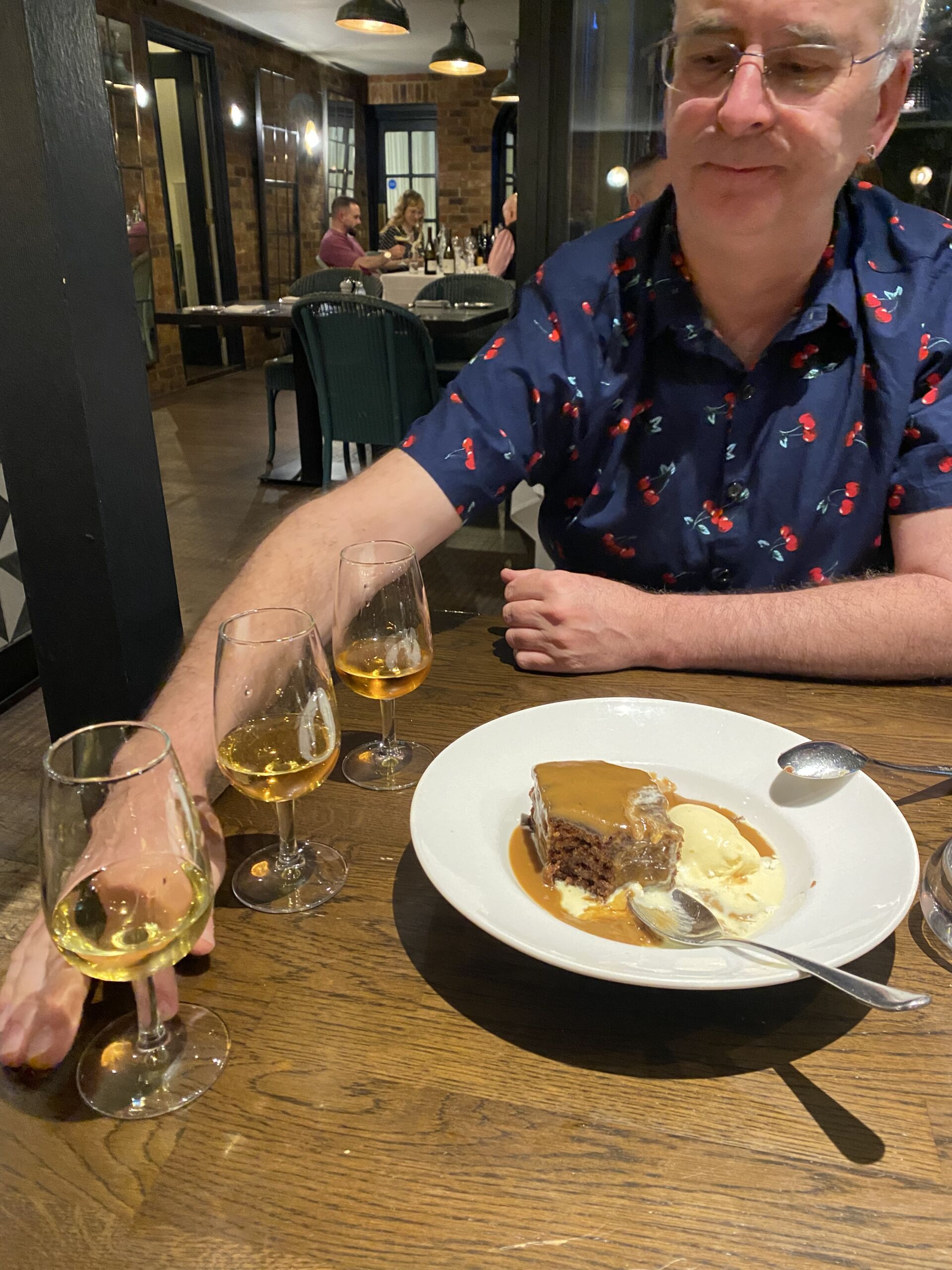 A man with 3 glasses of dessert wine